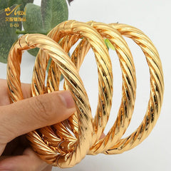 Luxurious African Jewelry: Gold-Toned Copper Bangle Bracelet for Women - Flexi Africa - Flexi Africa offers Free Delivery Worldwide - Vibrant African traditional clothing showcasing bold prints and intricate designs